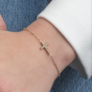 Armband kruisje steentjes goud