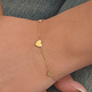 Drie hartjes armband goud