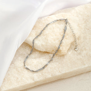 Gedraaide enkelband zilver