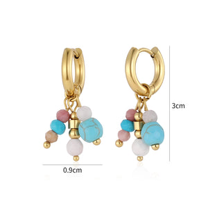 Oorbellen blauw gekleurde kralen goud