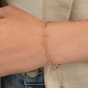 Tweelaags bolletjes armband goud