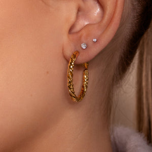 Hoops gedraaid motief goud