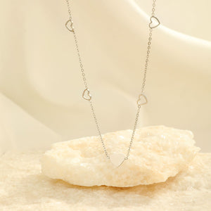 Ketting vier open hartjes zilver